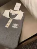T-shirt feminina designer de cores bloqueio CE bordado polo colarinho de manga comprida camisola de malha 2023 novo ajuste fino e efeito de emagrecimento com camisa inferior de fivela de ouro RIRR