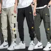 Mince Streetwear pantalons décontractés hommes rubans Harem Jogging pantalon mâle Slim Fit printemps Cargo pantalon multi-poches femmes pantalon 231227