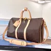 Högkvalitativ designer Duffel Bags Woman Travel Bag Women Män handväska Tote Stor storlek med blommor Bokstäver GRATIS frakt