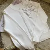 Kvinnors stickor 2023 Kvinnor Cardigan Solid Sweater Thin Heavy Industry Pärögd Bow Fashion O-Neck Långärmning Kort kappa