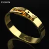 Mode kvinnor manschettform speciella låsarmband armband 316l rostfritt stål naglar armband armband gult guld med CZ214Y