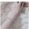 Bracciale in vendita Bracciale scintillante con combinazione multi-anello in cristallo alla moda, adatto per le amanti della sposa, sposa G