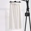 Jupe tricotée solide pour femmes 2024 Vintage bord brut taille haute a-ligne irrégulière gland taille élastique Midi jupes amples F29 231228