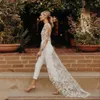 Lace Jumpsuits Beach Boho Buho Suknie ślubne dla panny młodej długie rękawy seksowne backless country ślubne suknie ślubne z pociągiem