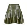 2023-24 Sommar Nytt läder PU-lager designkänsla fast färg oregelbunden a-line halv längd kjol för kvinnor