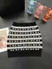Miumius İki Parça Elbise Tasarımcı Markası 2023 Sonbahar/Yaz Yeni Kontrast Şerit Mektubu Örme Üst Yarım Etek Seti UCTB