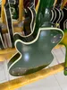 Dostosowana gitara elektryczna, Caston, Zielony duży kwiat, wykonany z importowanego drewna, szybka wysyłka opakowań