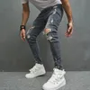 Mężczyźni Stylowe rozryte chude dżinsy ołówkowe spodnie streetwearu męskie dziury hip -hopowe rozciągnij Slim Denim Spodni 231227