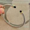 Bangle Cable Classic Collection Bracelet مع Topaz Blue و Black Onyx 18K Gold303i