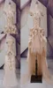 Robes de mariée gothiques élevés bas 2020 asymétrique hors de l'épaule Champagne en tulle applique strass de cristal avec manches 8633023