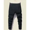 Jeans da uomo neri elasticizzati strappati skinny con stampa di cartoni animati con foro distrutto Jeans slim fit denim hip-hop di alta qualità