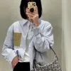 ファッションシャツの女性デザイナーブラウスメンズレザーレザーラベルストライプ長袖のシャツカジュアルカレッジスタイルカーディガンボタンコート