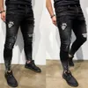 Jeans Hombres Moda Calle Agujero Negro Lápiz Pantalones Motocicleta Fiesta Casual Pantalones de mezclilla Cremallera Diseño fresco 231227