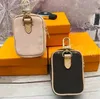 Chaveiros de designer de letras clássicas imperdíveis mini bolsa carteira de couro chaveiro de luxo pingente de bagagem chaveiro de carro chaveiro para charme homens mulheres moda fone de ouvido saco de armazenamento