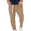 Pantalon homme taille réglable Streetwear sarouel pour hommes coupe ample ceinture élastique poches de ceinture couleur unie Long