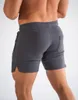 Męskie sporty sportowe spodnie treningowe męskie mięśnie multi-kieszeni krótkie spodnie Summer Szybkie suche spodnie na plażę Szkolenie spodnie do koszykówki