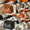 Cowhide Luxe Designer Tassen Echt lederen TOTE Handtas Top Kwaliteit Crossbody Bag Mini Soft Clemence Damesbakken Dumpling -portemonnees met gouden hardware lange riemtas