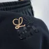 LOEWEE PANTSデザイナーファッション女性のカプリピュアコットンラージループ刺繍スリミングパンツ特大のメンズパンツユニセックスブラックグレースポーツパンツ