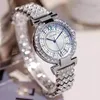 Montres-bracelets Femmes de luxe Montre Sky Star Set avec des coquilles de diamant Points bleus imprimés sur le cadran blanc Diamond-Set Steel Strip Quartz