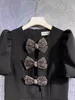سوداء مصمم الفقاعة الأكمام جوفاء القوس فستان Hepburn على غرار العمر تقليل الخصر التخسيس تنورة قصيرة الخط