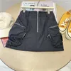 Spódnice pikantna dziewczyna w stylu roboczym krótka spódnica dla kobiet 2023 Letnia A-line Wrap Design Duża kieszeń na wpół modna
