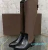 Damen-Martin-Cowboy-Schneestiefel aus schwarzem Leder mit luxuriösen High Heels aus Holz