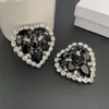 Boucles d'oreilles dos 2024 célèbre marque de créateur boucle d'oreille coeur en cristal noir grand clip d'oreille femme bijoux de luxe de qualité supérieure cadeau de fête d'anniversaire