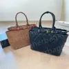 Fourre-tout de luxe Modes véritables Grand sac fourre-tout en cuir pour femmes Sacs à main de shopping décontractés et polyvalents Sac à bandoulière chaud en forme de diamant noir pour femme