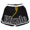 Rhude Mens Shorts Designer Mais Curto Homens Mulheres Nadar Curto Caju Flor Malha Cordão Capris Homens Casais Corredores Sportswear Solto Ru Casual Praia Sweatpants