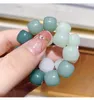 Bracciale con perline in resina con coppia di cordini a mano, piatto intrecciato a mano con fiori di pesco rosa graduale, ragazza portatile