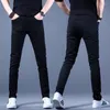 メンズジーンズ2023春秋のドリルゆるい細い男性スリムフィート弾力性のあるレジャーダークプランクトンファッションハンサムな長いズボン