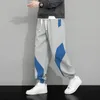 Mäns byxor Spring och Autumn Fashion Color Blocking Casual Sports Loose Drawstring Elastic Midje Sweatpants med fickor