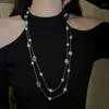 Naszyjniki wiszące europejskie i amerykańskie kryształowy perłowy wielowarstwowy długi naszyjnik niszowy łańcuch obojczyka swetra kobiety