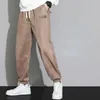 Pantaloni da uomo in pelle scamosciata per la primavera e l'autunno 2023 Leggings sportivi larghi di marca alla moda Casual versatile