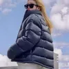 Parkas de plumón para hombre Chaqueta de plumón negra de invierno para hombre Nocta diseñador Abrigo de plumón Grande en la parte posterior Chaquetas de pan grueso hombres mujeres moda abrigos parka cálidos al por mayor