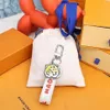 MP3225 Мужской и женский брелок L MADE DRAGONNE BAG CHARM И КЛЮЧНИЦА232Q