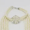 Nya modetillbehör Kvinnor Långa pärlor halsband med diamant inlagd pärlblomma halsband pärlor örhängen lång tröja kedja