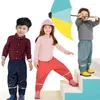 Pantalon PU imperméable pour bébés filles, pantalon de pluie polaire chaud pour garçons, collants de Sport en velours pour enfants, vêtements thermiques d'extérieur et d'hiver pour enfants