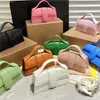 Дизайнеры кожаная сумка Bambino Beald Suckbag Сумка знаменитая мини -маленькая сумочка с регулируемым ремешком поперечного корпуса.