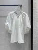 Blusas de mujer Camisas diseñador 23 Primavera / Verano Elegante Cadena de cuentas Triángulo hueco Plisado Murciélago Camisa de manga de burbuja Top 49YI