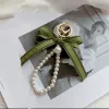 Designer sleutelhanger Luxe sleutelhanger tas charme vrouwelijke auto sleutelhanger Parel charme groen lint delicate schelpen sleutelhanger paar hanger cadeau leuk goed