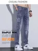 Jeans pour hommes designer 2023 Fashion Brand New Élastique Pieds Slim Fit Printemps / Été Mince À La Mode Jeunesse Pantalon Lâche UHPJ