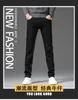 メンズジーンズデザイナー秋のファッションブランド韓国のスリムフィットパンツスリムフィットシックハイエンドヨーロッパユースパンツQZTZ