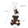 Porte-clés ours à carreaux de luxe porte-clés de voiture en cuir de créateur classique exquis lanière unisexe en alliage de Zinc