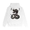 Designer Mens Graphic Sweats à capuche Femmes Sweatshirts à capuche à long terme Marque de mode Serpent géant imprimé Amari Sweat à capuche Casual Pull en coton Lâche Varsity Vêtements P5R9