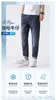 Jeans da uomo firmati Jeans elastici sottili primaverili per pantaloni da uomo in denim slim fit versione coreana blu scuro piccola gamba dritta JPB7