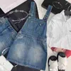 Grundläggande casual klänningar Designer 23 Vår/sommar modeålder reducerar brev triangel höjd midja smal tvätt denim rem klänning ik9b