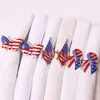 Självständighetsdag tema servettringar bowknot form servetthållare för patriotisk dekoration flagga serviete spänne