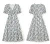 2023 Verão Branco Vestido Estampado Floral Manga Curta Decote V Midi Vestidos Casuais W3L043501