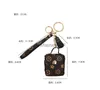 패션 디자이너 AirPodScase Keychains Trinkets PU 가죽 키 반지 체인 보석류 갈색 꽃 펜던트 가방 매력 키 링크 키 홀더 패션 액세서리